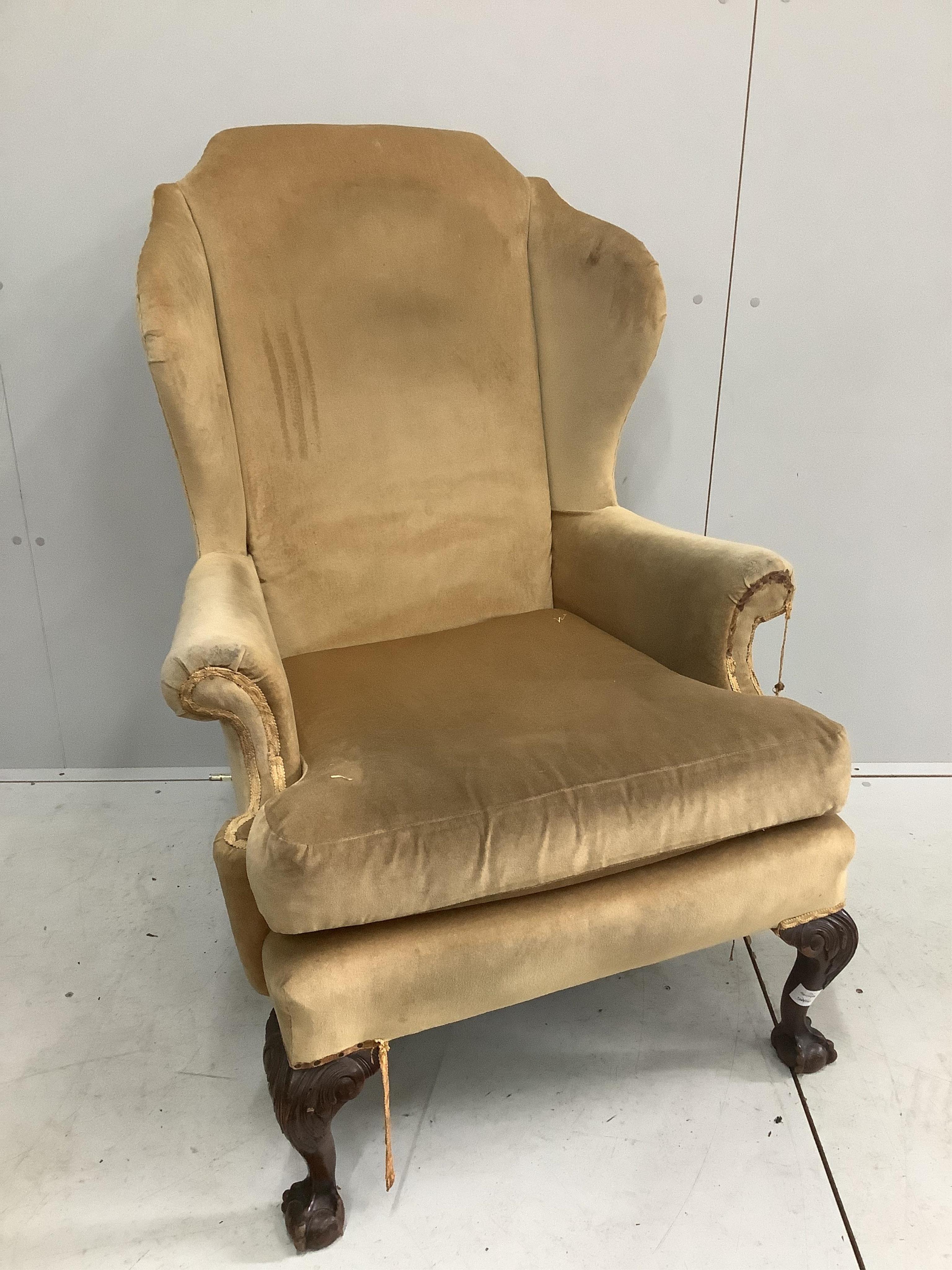 A George III style wing armchair, old gold dralon upholstery, width 82cm, depth 74cm, height 116cm. Condition - fair